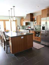 Just make sure that the color tones compliment each other and don't clash, or else your transition may backfire. Dark Tile Kitchen Floor Novocom Top