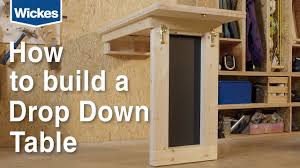 Insert the bushings and trunnions into their holes in the bed ends, and then slide the bed/desk assembly into the carcass. How To Build A Wall Mounted Down Drop Table With Wickes Youtube