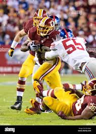 Washington Redskins running back Alfred Morris (46) carries the ball in the  first half against the New York Giants at FedEx Field in Landover, Maryland 
