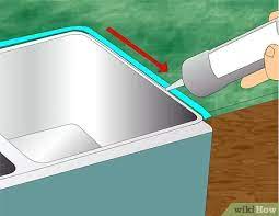 Use denatured alcohol to clean up any leftover caulk. How To Caulk The Kitchen Sink With Pictures Wikihow