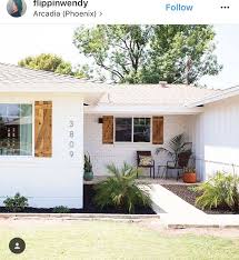 Black And White Painted Brick House White Painted Brick Wood Shutters Painted White Brick House White Brick Houses White Exterior Houses