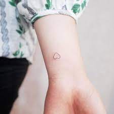 Wrist tattoo with butterfly and heart. Heart Tattoos On Wrist 40 Tiny Hearts On Wrists For Girls