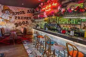 Neon Mexican Flowers Day Of The Dead Interior Design Mexican Restaurant Design Mexican Restaurant Decor Mexican Restaurants Interior
