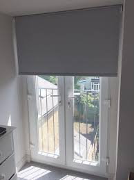Today, french doors come in a wide variety of styles, from uninterrupted panes of glass to ones energy efficient french doors exterior. Blackout Roller Blind In Flint Colour To French Doors For A House In Tooting Http Www Theblinds Blinds For French Doors Patio Door Blinds Patio Door Rollers