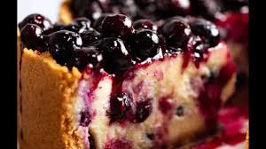 Dip peanut butter balls into coating; Blueberry Cheesecake Recipetin Eats