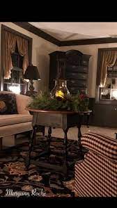 The centre of the room is characterized by three antique trunks, a rustic bench, a green sofa, and a dark armchair. 210 Best Colonial Living Rooms Ideas Colonial Living Rooms Colonial Decor Primitive Living Room