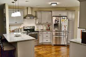 Decorative feet on sink base. Florida Kitchen Kraftmaid Pebble Grey Traditional Tampa By Dustin Houzz