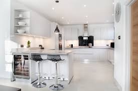 In this article we will show you that this combination can be an interesting option. Light Grey Handle Less Kitchen With Black Splash Back Modern Kitchen Buckinghamshire By Design A Space Kitchens Bedrooms Interiors Houzz