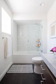 This minimal, rustic bathroom makes the best out of the least amount of decor possible, with a wooden ladder for the towels, a concrete floor, and open wood vanity. Bathtub Refinishing Ideas Bathroom Remodel Shower Shower Remodel Bathrooms Remodel