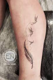 Feather Birds Tattoo By Erkan Nehir Feather With Birds Tattoo Tattoos Feather Tattoos