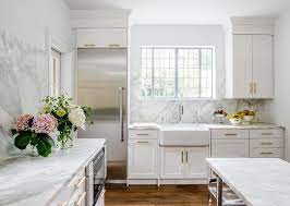 To stunning examples of white cabinets; White Kitchen With Marble Slab Backsplash Transitional Kitchen