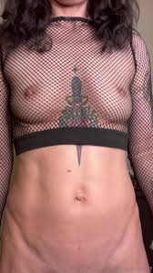 Her body jiggles - Nothing but a fishnet top as she moves her hips