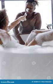 Lady Taking Bath and Having Fun with Her Boyfriend Stock Photo 