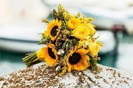 Minimalist winter bouquet with sola flowers and pinecones. 22 Stunning Sunflower Wedding Bouquet Ideas Sunflower Wedding Bouquet Bridal Sunflowers Simple Wedding Flowers