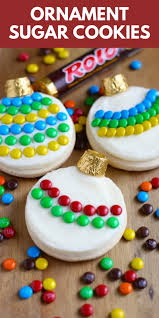 Soft christmas cookies in gingerbread man, candy cane, and tree shapes on a white plate credit: Decorating Ornament Sugar Cookies Your Cup Of Cake