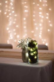 Centerpieces Filled With Moss And Fairy Lights Next To Mason Jars With Babies Breath Outdoor Wedding Decorations Lighted Centerpieces Babys Breath Centerpiece