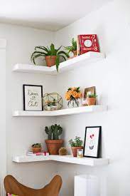 Alluring Corner Floating Shelves Idea Finished In White And Mounted On White Wall Paint Color Idea For Display Shelves Small Bedroom Decor Home House Interior