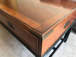 The design is very straight lined and contemporary. Thomasville Wood And Brass Campaign Style Coffee Table With Drawers And Inlaid Wooden Top Coffee Table With Drawers Wooden Tops Thomasville