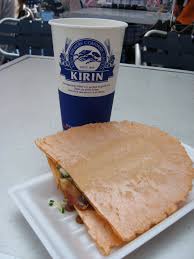 Tama Sen A Griddle Fried Egg Sandwiched Between A Big Shrimp Cracker Drizzled With A Little Japanese Brown Sauce