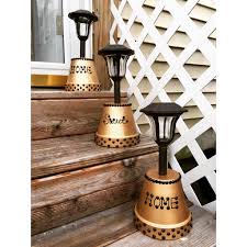 Cute Idea To Set Out Your Solar Lights Table Top Or Lining Your Stairs For Extra Light Clay Pot Projects Lighting Your Garden Rustic Lighting