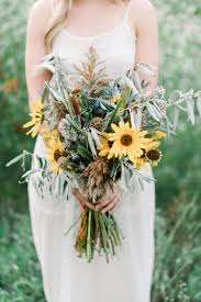 I love mixing the smooth, glossy snowberries that look like. 20 Sunflower Bouquets That Will Brighten Up Your Wedding Day Sunflower Wedding Sunflower Wedding Bouquet Bridal Sunflowers