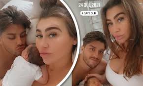 Lauren Goodger cradles daughter Larose alongside beau Charles Drury