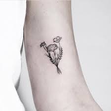 Floral tattoos have become common elements in the tattooing work as most of the tattoos are incorporated with flowers. Tiny Bouquet Tattoo By Rach Ainsworth Tattoogrid Net