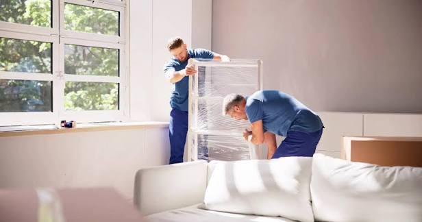 Professional moving company protecting furniture before a house move in Mauritius