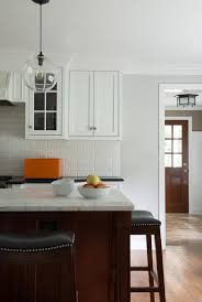 The cherry wood kitchen cabinets come with impressive materials and designs that make your kitchen a little heaven. White Kitchen With Cherry Island Design Ideas