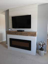 Shiplap details help to create a rustic cottage feel alongside brilliant fire that can be enjoyed with or without heat for a cozy home all year long. Shiplap Fireplace Landhausstil Wohnbereich Toronto Von Chantelle Mcneish Design Houzz