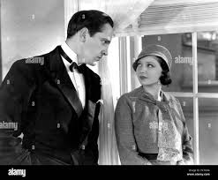 MERRILY WE GO TO HELL, Fredric March, Sylvia Sidney, 1932 Stock Photo -  Alamy