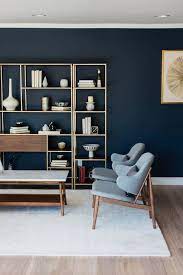 The Dark Blue Wall With The Brass Gold Wood Grid In Front Of It Swoon Might Be An Amazing Loo Mid Century Modern Living Room Mid Century Living Room Home