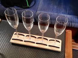 The removable glass flutes are held in place with the word love and joined together on a silver plated heart shaped base. Champagne Flute Holder