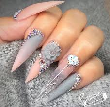 Grey Pink Ombre Nails With White Diamonds Stiletto Stiletto Nails Designs Long Stiletto Nails Pink Ombre Nails Style up the pink and black design with these shiny bow ties, and wear it on a matching dress so that you can this acrylic nail style is of utmost importance to any formal event with black and white glossy base coat and silver decals including rhinestones.