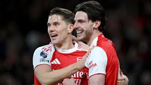 Arsenal dig deep to beat Brighton and reclaim top spot