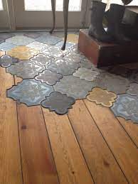 Mixing Floor Materials Taken To Another Level With Intricate Patterned Arabesque Shaped Tiles Used Together With Wood Plank Floor Design House Design Flooring