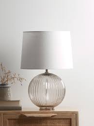 Like small jewels in shiny brass and grey clear glass, the lamps in the solklint series spread a soft mood light that creates exciting shadows on walls and ceilings the lamp gives a soft light and creates a warm, cosy atmosphere in your room.light bulb sold separately. Round Fluted Glass Table Lamp