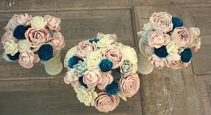 1 bride's round bouquet (10 round) made with ivory, navy blue and peach roses, few cream calla lilies, few peach rosebuds, ivory tweedia and navy blue baby's breaths accented with silver pearls, the thick handle is wrapped in silver satin and decorated with rhinestone cuff and silver organza bows. Sola Flower Bouquet Brides Wedding Bouquet Navy Blue And Blush Pink Wedding Flowers Du Pink Wedding Flowers Blush Pink Wedding Flowers Cheap Wedding Flowers