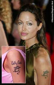 Laser removal is a painful process and, even after five trips to the removal clinic, the inking is still slightly visible. Angelina Jolie S Past And Present Tattoos And Their Meanings Tatring