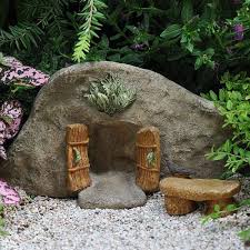 A fairy garden actually has fairy in its name and that immediately suggests something whimsical the garden was also decorated with a mini wire arch and door, a mini bird bath, some river rocks. Cove Fairy Door Fairy Garden Landscaping Miniature Door Baby Feathers Gift Shop
