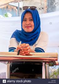 Download This Stock Image Indonesian Muslim Female Wearing Hijab Faces The Camera And Pose For Social Media Profile 2a7y610 From In 2020 Poses Stock Photos Muslim