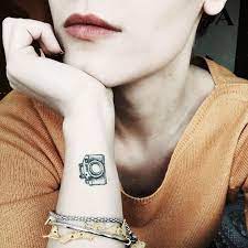Your wrist is one of the most delicate and flattering places to ink and can be hidden and revealed with the ease of a top choice. Wrist Camera Tattoo For Women Camera Tattoos Camera Tattoo Tattoo Photography