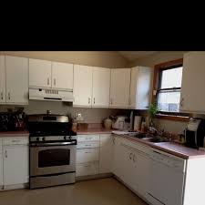I'll show you how to paint melamine and oak kitchen cabinets and update them with new hardware. Before After Gemma S Under 200 Kitchen Spruce Up Kitchen Kitchen Cabinet Styles Home Kitchens