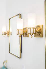 As light diffuses through, you can see the delicate veining of the stone, adding subtle texture. Antique Brass Medicine Cabinet And Sconces Sophia Shibles Scs Design Interiors Bathroom Sconces Trendy Bathroom Brass Bathroom Fixtures