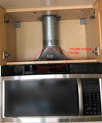 The kitchen vent fan must exhaust directly to the outside, not into an attic, crawlspace, or a space between floors. How Can I Remove A Mouse Stuck In The Air Duct Above A Kitchen Exhaust Fan With Built In Microwave Home Improvement Stack Exchange