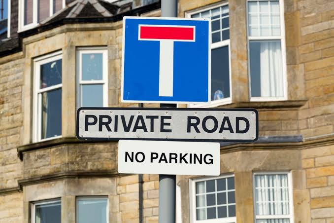 What does a no through road sign mean?