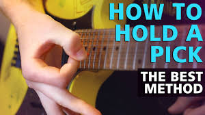 They do this so they can see their fingers, but this is bad for posture and practice time because it causes fatigue. How To Hold Your Guitar Pick Properly The Best Way With Close Up Examples Youtube