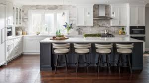 Love This Look Light Cabinets With Dark Island And Light Counter With Stone Like Backsplash Wi Kitchen Backsplash Designs Kitchen Trends White Kitchen Design