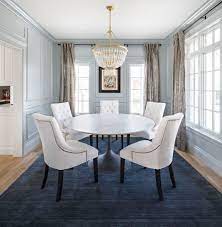 How to upholster dining room chairs tutorial {and a sneak peak at my dining room}. Traditional Dining Room Blue Area Rug Beaded Chandelier Round Dining Table White Uphol Dining Room Blue White Dining Room Table Round Dining Room Table