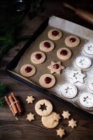 According to their research, christmas cookies as we know them today were created from medieval european recipes. Making Christmas Linzer Cookies By Pixel Stories Christmas Cookie Stocksy United